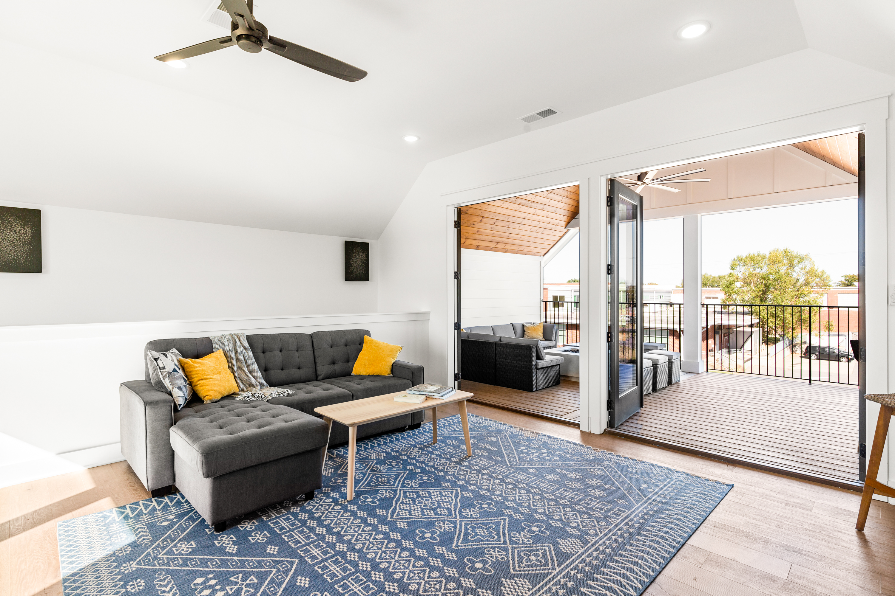 Cozy entertainment space with TV, poker table, and comfortable seating